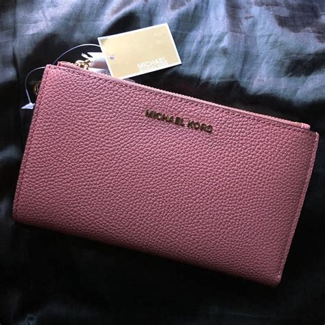 michael kors wallet pink and black|Michael Kors pink wristlet wallet.